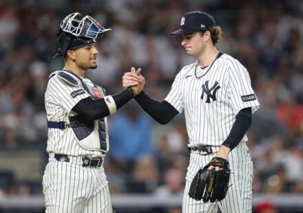 Jun 19, 2026; Bronx, New York, USA; New York Yankees pitcher Cam Schlittler (31) shakes hands with catcher J.C. Escarra (25) after the top of the sixth inning against the Cincinnati Reds at Yankee Stadium. Mandatory Credit: Vincent Carchietta-Imagn Images
