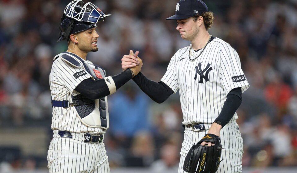 Jun 19, 2026; Bronx, New York, USA; New York Yankees pitcher Cam Schlittler (31) shakes hands with catcher J.C. Escarra (25) after the top of the sixth inning against the Cincinnati Reds at Yankee Stadium. Mandatory Credit: Vincent Carchietta-Imagn Images
