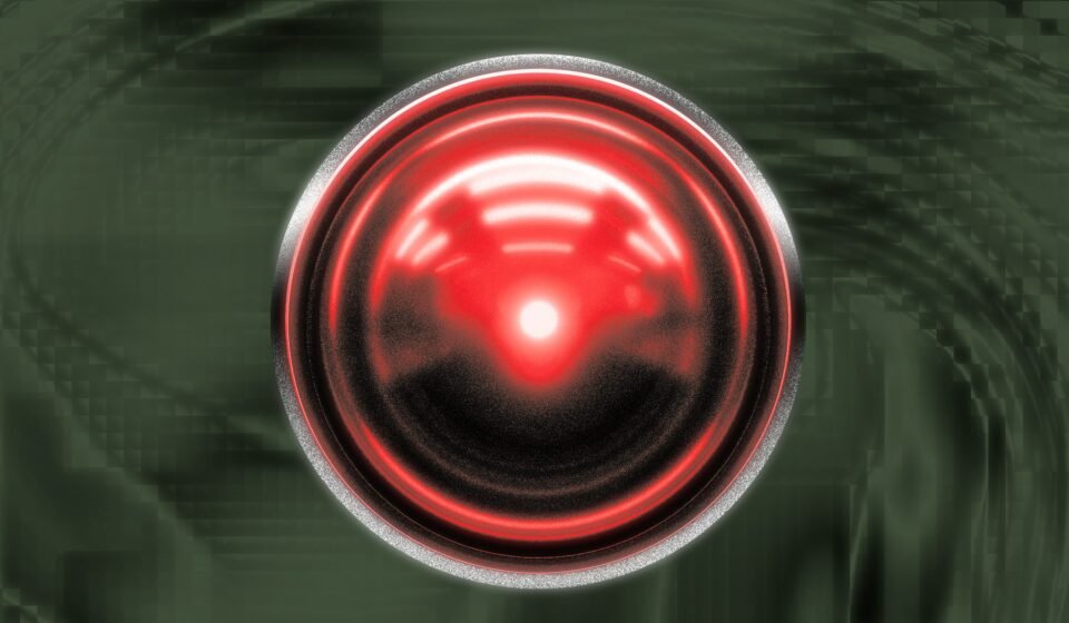 H.A.L. style glowing red digital eye over a textured digital backdrop.