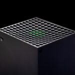 The upper part of the Xbox Series X placed against a black background.